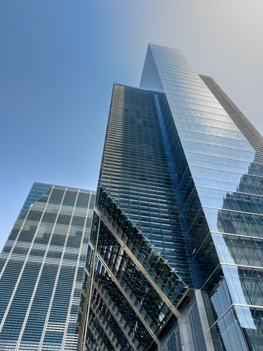 City skyscraper top floors with glass windows