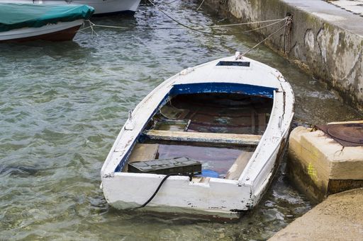An old wooden boat at the pier