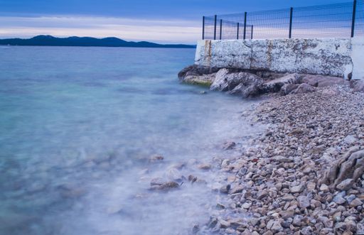 A beautiful shot of a seashore with a clear blue sky