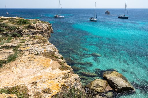 An aerial shot of Cala Azzurra cliffs and the sea in Favignana Aegaian Islands Sicily
