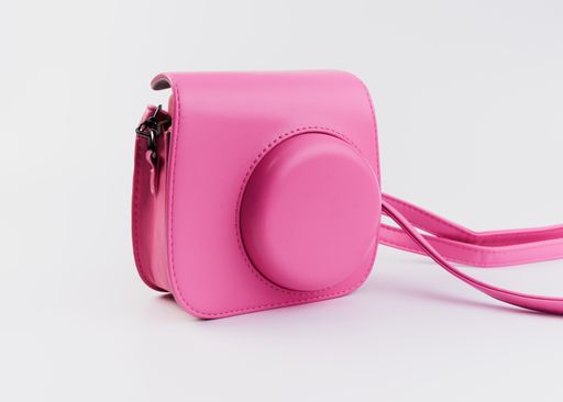 A pink polaroid isolated on a white background