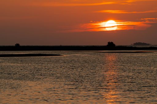 A scenic view of sunset over the Gulf of Mexico