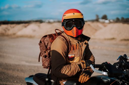 Motorcycle rider wearing helmet and goggles