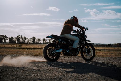 Man riding dirt bike in sunny field