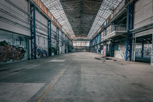 An abandoned warehouse with graffiti on the walls