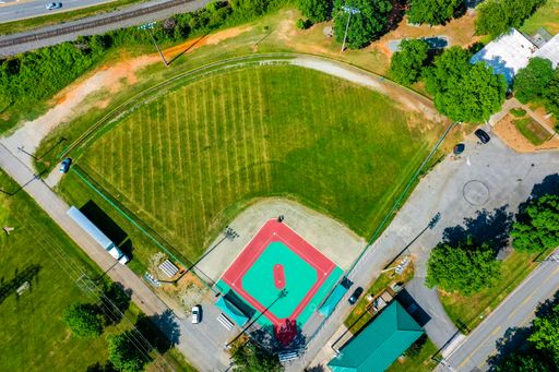 An aerial shot of a baseball practice field under the sunlight