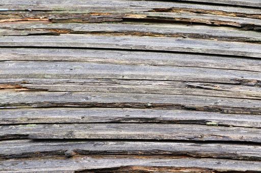 A closeup shot of the dark surface of the wood