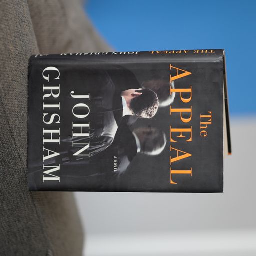 A close-up of the book cover for John Grisham's 'The Appeal'