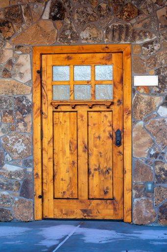A vertical shot of a wooden front door