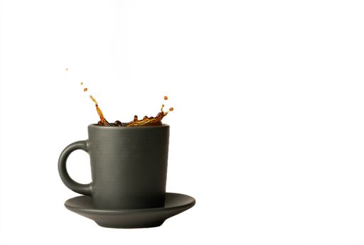 coffee mug with splash effect splashes isolated on white background and copy space