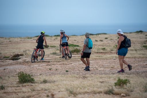 Cap de Barbaria, Spain: 2021 June 17: People touring the Cap de Barberia lighthouse on the Island of Formentera in Spain.