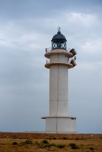 A vertical shot of the Cap de Barberia lighthouse on the island of Formentera in Spain