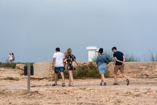 Cap de Barbaria, Spain: 2021 June 17: People touring the Cap de Barberia lighthouse on the Island of Formentera in Spain.