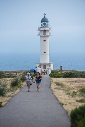 Cap de Barbaria, Spain: 2021 June 17: People touring the Cap de Barberia lighthouse on the Island of Formentera in Spain.