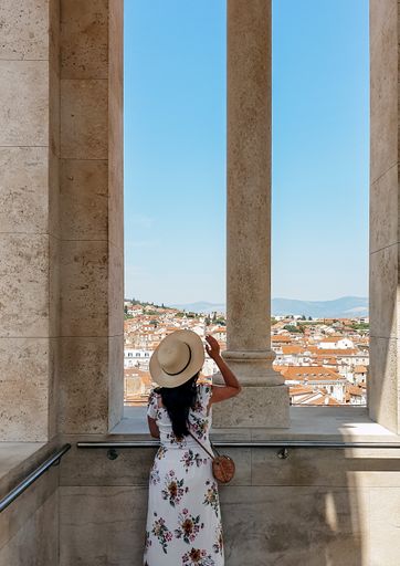 Woman Sightseeing the beautiful St.Domnius cathedral inside Diocletian's palace with spectacular view of City of Split in Croatia.