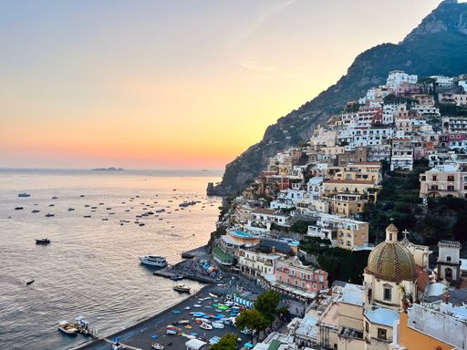A scenic view of Positano at sunset. Amalfi Coast, Italy