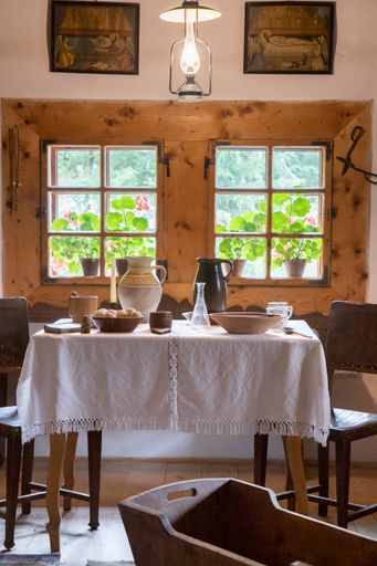 A white table in a room with a large window walll