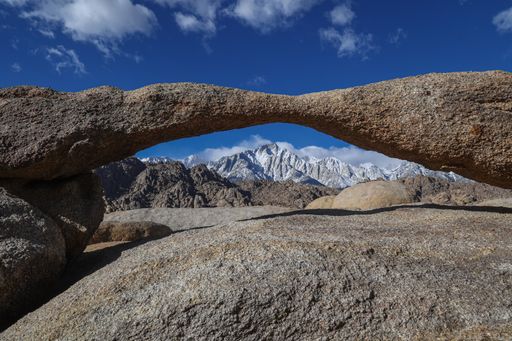 Lathe Arch framing Mt Whitney and the Sierra Nevada mountains is a popular hiking destination in the Alabama Hills National Scenic Area