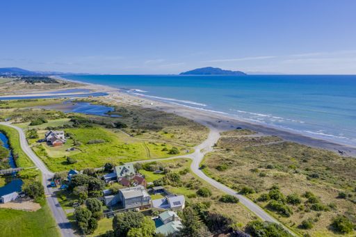 An aerial shot of Otaki Beach in New Zealand showing Kapiti island in the distance
