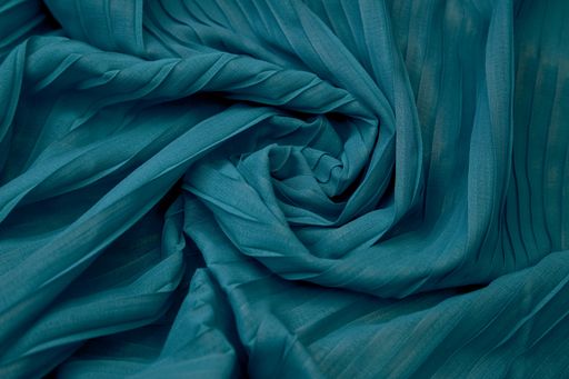 A Teal blue fabric overlapping pattern on the center