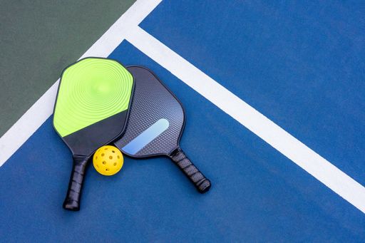 A Pickleball Racquet's on blue court