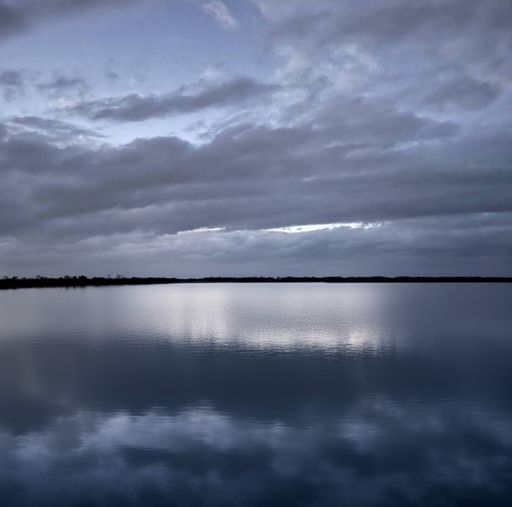 A dark sky over Lake Conroe in the evening