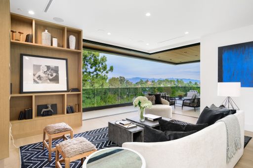 A contemporary living room with a mountain view.