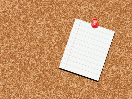 Red push pin on cork board