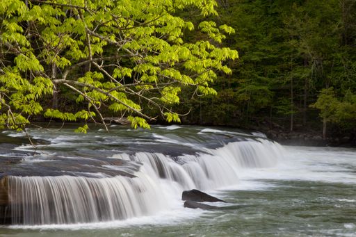 The beautiful Valley Falls surrounded with trees in the spring at Valley Falls State Park in West Virginia