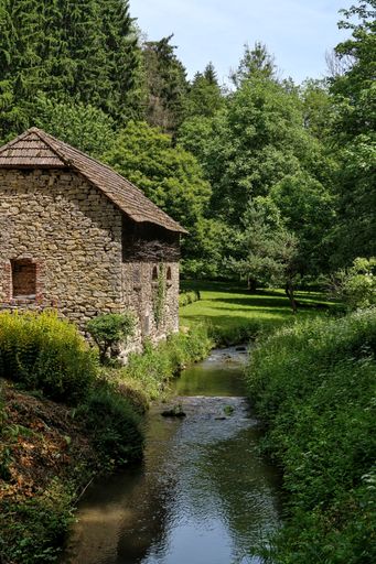 A vertical shot of an old stone cottage at Igeler Mill in Bergisch Gladbach, Germany