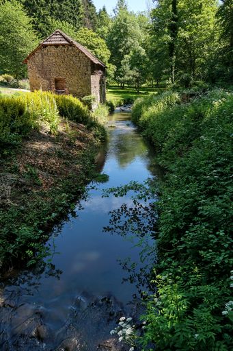 A vertical shot of an old stone cottage at Igeler Mill in Bergisch Gladbach, Germany