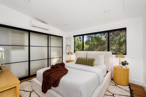 A modern Hollywood Hills home bedroom in Los Angeles, California, with a remodel of an older house