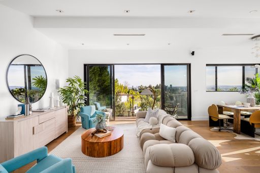 A modern Hollywood Hills home living room in Los Angeles, California, with a remodel of an older house