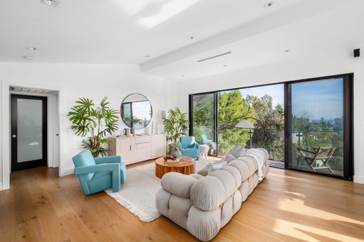 A modern Hollywood Hills home living room in Los Angeles, California, with a remodel of an older house