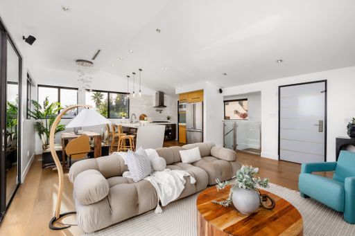 A modern Hollywood Hills home living room in Los Angeles, California, with a remodel of an older house