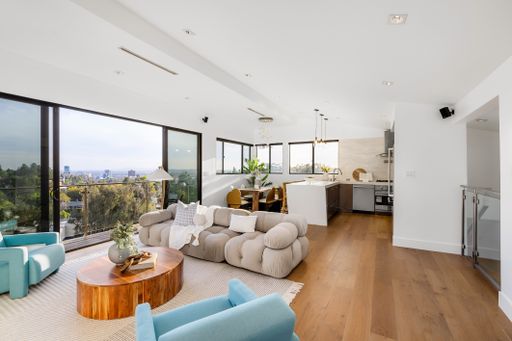 A modern Hollywood Hills home living room in Los Angeles, California, with a remodel of an older house