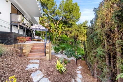A modern Hollywood Hills home garden in Los Angeles, California, with a remodel of an older house
