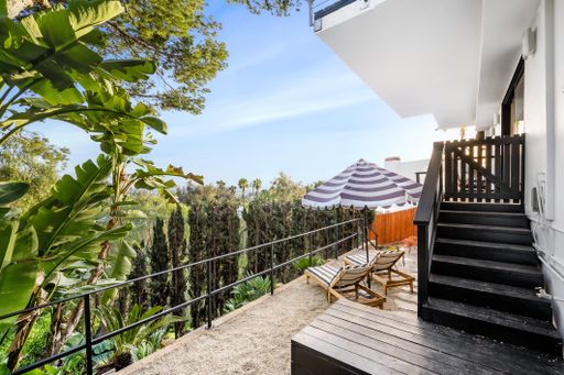 A modern Hollywood Hills home balcony in Los Angeles, California, with a remodel of an older house