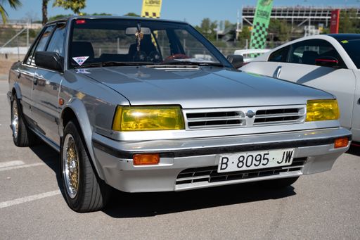 Front view of a classic Japanese sports car Nissan Bluebird 2.0SLX of the T12 T72 Series generation in silver gray
