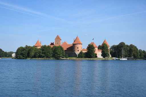 The beautiful Trakai castle by the lake in Lithuania on a blue sky sunny day