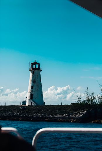 a breathtaking view of a majestic lighthouse standing steadfast against the shoreline