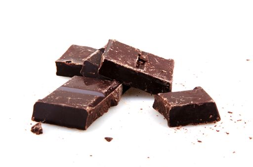 A closeup of dark chocolate bars isolated on white background