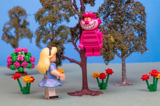 The scene of Alice talking to the Cheshire Cat sitting in a tree
