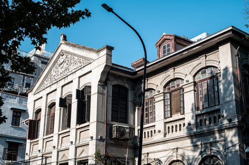 On a sunny day, a uniquely designed European style building with a hundred years of history. Wuhan, China.