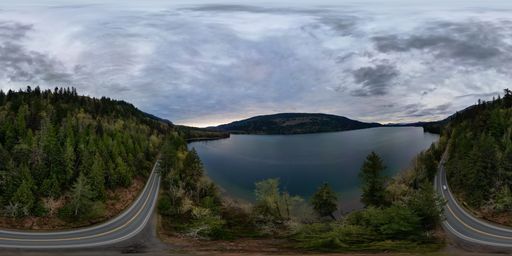 360 Aerial View of the Lake and Mountains. Dramatic Cloudy Sky. British Columbia, Canada.
