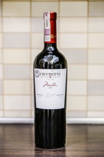 Wine in a bottle on a table.