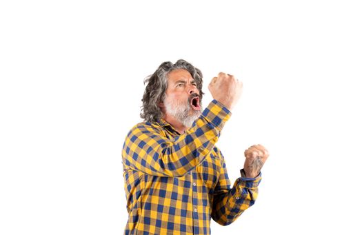 A middle-aged angry man shouting and gesturing with raised hands