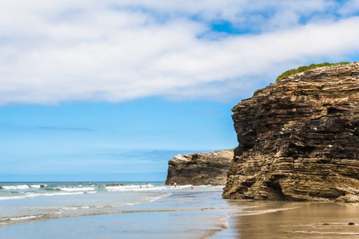 Ribadeo, Lugo, Galicia, Spain - July 26, 2020: Tourists walking along the Playa de las Catedrales (Aguas Santas), at low tide, declared a Natural Monu