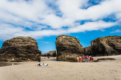 Ribadeo, Lugo, Galicia, Spain - July 26, 2020: Tourists walking along the Playa de las Catedrales (Aguas Santas), at low tide, declared a Natural Monu