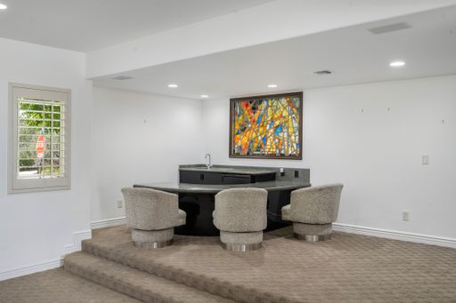 An elegant living room with dining set, four chairs in Encino, California